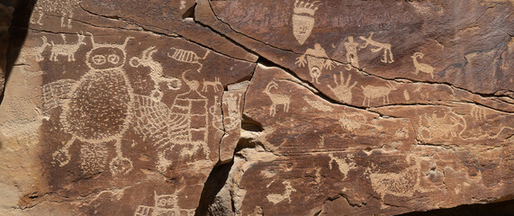 Native American Indian rock art petroglyph owl panel panorama 1409. Nine Mile Canyon, Utah....