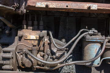 Fototapeta premium rusty old motor engine oil, bolts and nuts close up