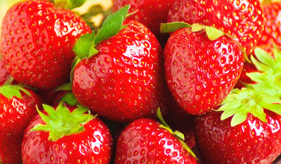 Red ripe strawberry closeup, texture, background, horizontal orientation.