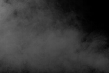 White smoke on a black background. The texture of scattered smoke. Blank for design. Layout for collages.