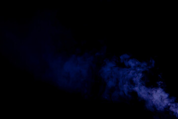 White smoke on a black background. Colored smoke with a blue and purple tinge. The texture of scattered smoke. Blank for design. Layout for collages.