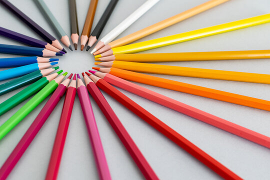 a selection of colourful pencils set in a circle rainbow 