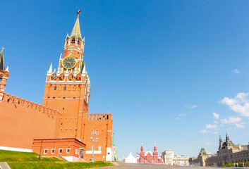 Fototapeta premium View of Spasskaya Tower of Moscow Kremlin on a summer morning. Clear blue sky in the background. Copy space for your text.