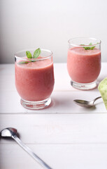 Cold strawberry soup with mint in glasses