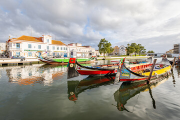 Colorful Moliceiro boat rides in Aveiro are popular with tourists to enjoy views of the charming canals.