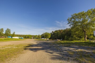 Beautiful landscape view on summer day. Beautiful view of  trees and green plants on blue sky background. Gorgeous natural backgrounds. 