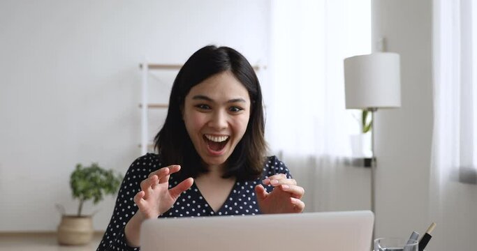 Excited asian student girl feels euphoric got exam results celebrating successfully pass college admission. Online bet victory lottery win, moment of receiving happy news, hired work of dream concept