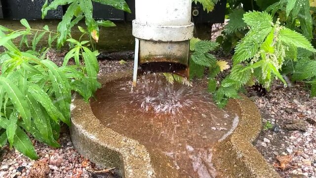 water flowing from a drainpipe