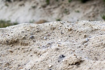 hill of river sand on a blurred background