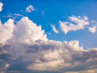 Massive clouds - Cumulus congestus or towering cumulus - on the blue sky