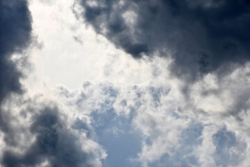 Dark and white fluffy clouds in the sky