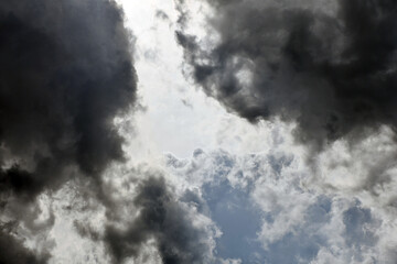 Dark and white fluffy clouds in the sky