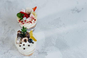 Two beautiful and delicious trifle cakes close-up on a light background. Dessert, healthy food