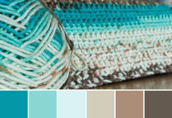 Close up colorful yarn texture background, beige, brown and blue strains. Shallow depth of focus....