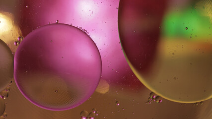 Macro structure of colorful oil bubbles. Chaotic motion. Abstract multicolored background. Pattern