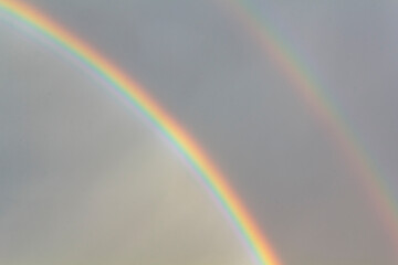 Double rainbow on dark sky