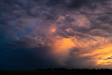 Fototapeta premium Storm clouds at dusk creating layers in the sky