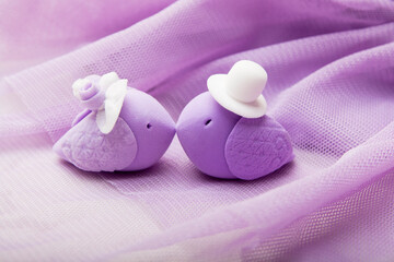 Decorative birds on a tulle background. Wedding day concept