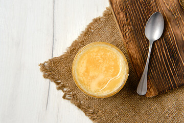 Pot with honey and spoon