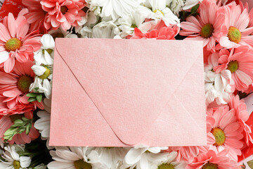 postcard mockup. floral background. bouquet of flowers and an envelope with place for text. bouquet of daisies