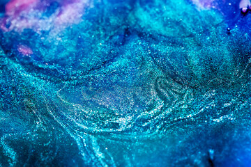 abstract blue sparkling background with swirls and waves
