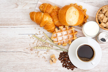 Fototapeta na wymiar Breakfast in the morning with black coffee cup with bread with Croissant and fruit on the wooden table.