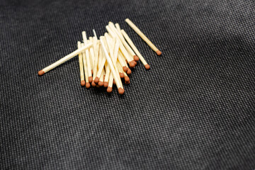 Match, on a black background. Macro shot, perfect for a shelf and for further post-production.