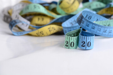 Measuring tape set on white background. Happy New 2020 Year concept. Measuring tape