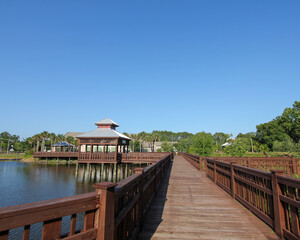 Boardwalk over the lake at Bird Island Park nature trail in Ponte Vedra Beach, Florida