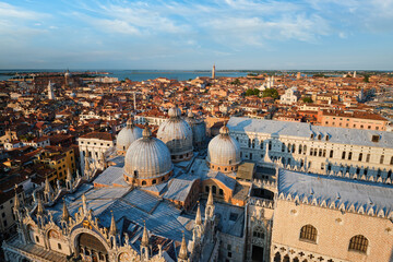 View of Venice with famous St Mark's Basilica and Doge's Palace on sunset from St Mark's Campanile...