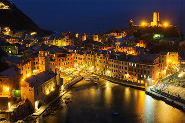 Fototapeta na wymiar View of Vernazza village popular tourist destination in Cinque Terre National Park a UNESCO World Heritage Site, Liguria, Italy view illuminated in the night from Azure trail