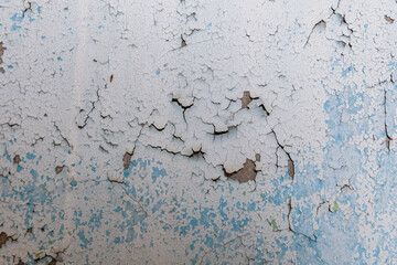 Background of the old wall in the abandoned apartment. Old paint cracked
