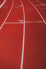 Running track lanes background for field athletics, red stadium surface with white lines