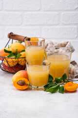 Apricot juice in glass. Healthy drink