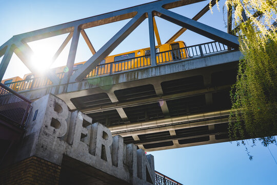 train passing by on a bridge in berlin