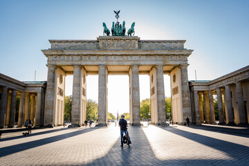man standing in front of brandenburg gate berlin germany