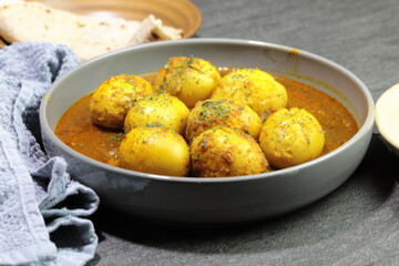 An Indian spread of spicy Egg curry or Egg Masala in a bowl