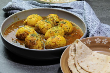 An Indian spread of spicy Egg curry or Egg Masala in a bowl