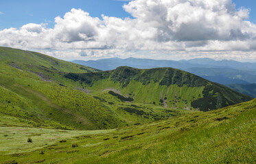 Fototapeta na wymiar Scenic landscape of Mountain range Chornohora with green slopes in summer day. Carpathian Mountains.