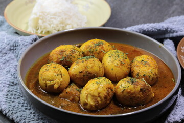 An Indian spread of spicy Egg curry or Egg Masala in a bowl