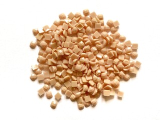 Set of soft pink diamonds for diamond embroidery isolated on white background. Hobbies and DIY, materials for creating diamond embroidery.