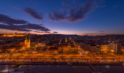 Panoramic aerial drone shot of Church of Stigmatisation of Saint Francis by Danube in Budapest sunset