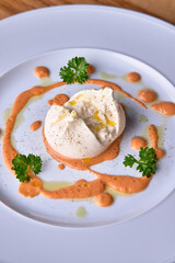 Italian traditional cheese burrata on white plate