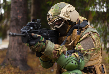 soldier is ready to shoot from the knee