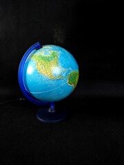 North America Turned Globe isolated on black background. Back to school. 