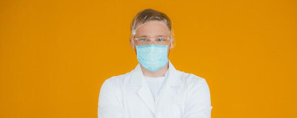Portrait young exhausted doctor in blue medical mask on face. Prevention of coronavirus nCov-19. Tired man wearing protective face mask as personal protection against COVID-19. Copy space