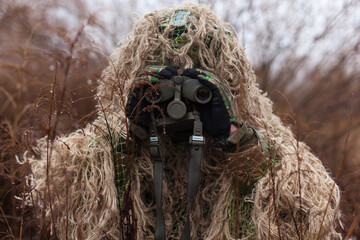 soldier with binoculars in his hands