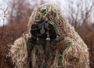 Ukraine modern kikimora soldier watches the enemy