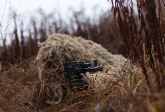 soldier is ready to shoot a disguised kikimora