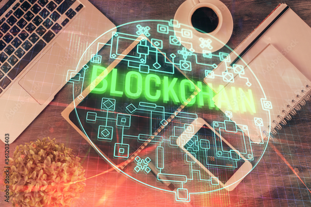 Poster Double exposure of blockchain theme hologram over table with phone. Top view. Crypto technology concept.